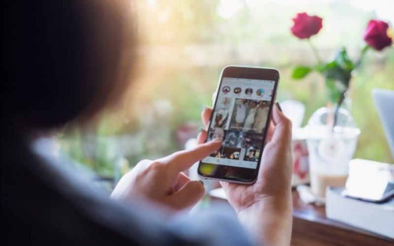 one girl checks the android instagram clone on mobile.