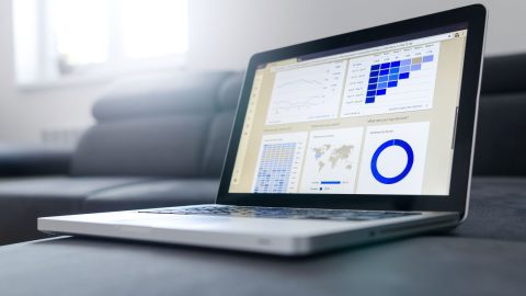 Laptop showing sales analytics dashboards