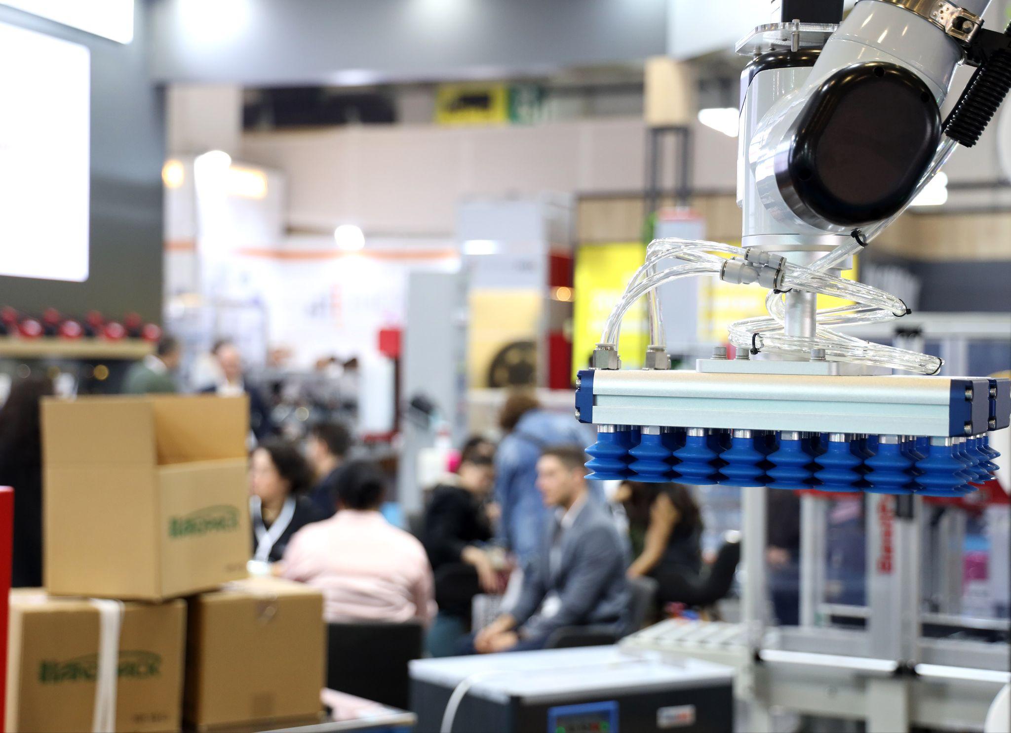 Packaging professionals worldwide head to Istanbul for Eurasia Packaging 2026: a robotic vacuum gripper lifting cartons on an exhibitor stand at Eurasia Packaging Istanbul